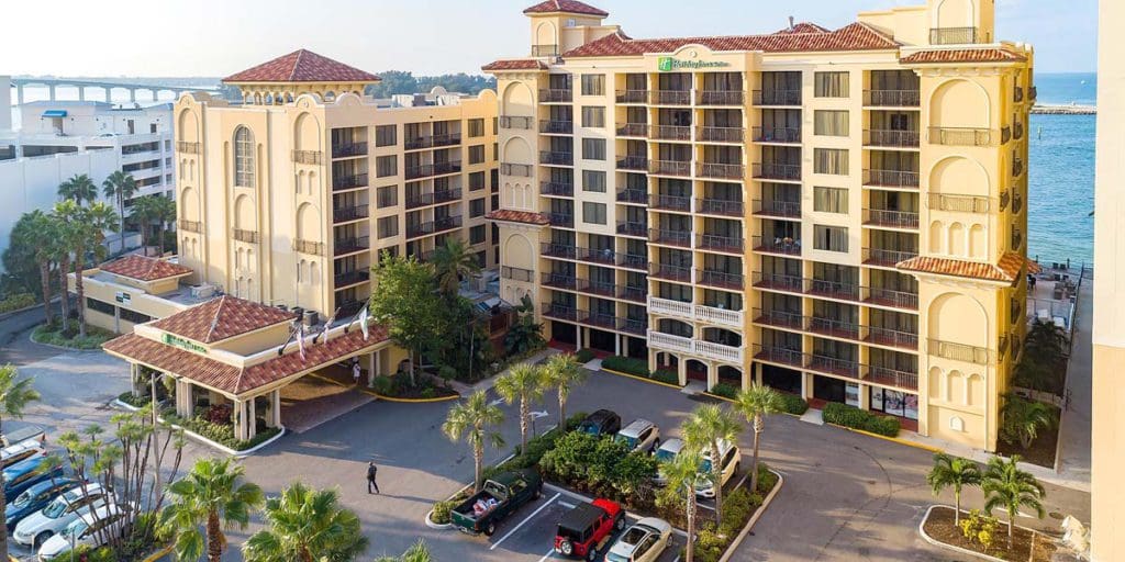 The large exterior to Holiday Inn & Suites Clearwater Beach S-Harbourside, an IHG Hotel, one of the best Florida hotels with water parks on the Gulf Coast for families.