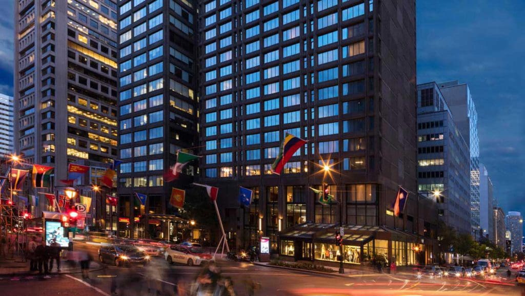 The exterior entrance to The Omni Mont-Royal Hotel at night.