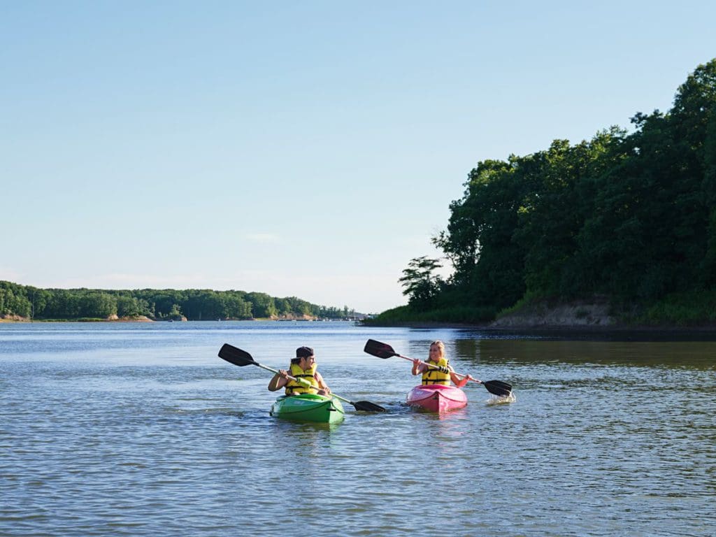 Two people kayak across Lake Shelbyville.