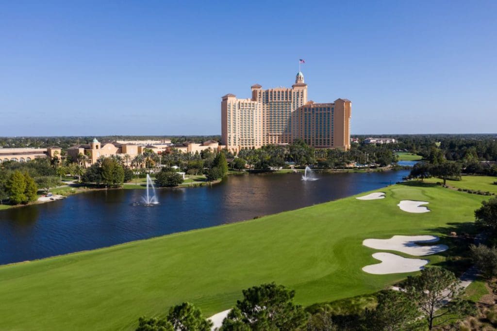 The JW Marriott Orlando, Grande Lakes stands proud across a stunning green stretch of the golf course and pond, one of the best hotels in Orlando with a waterpark for families.