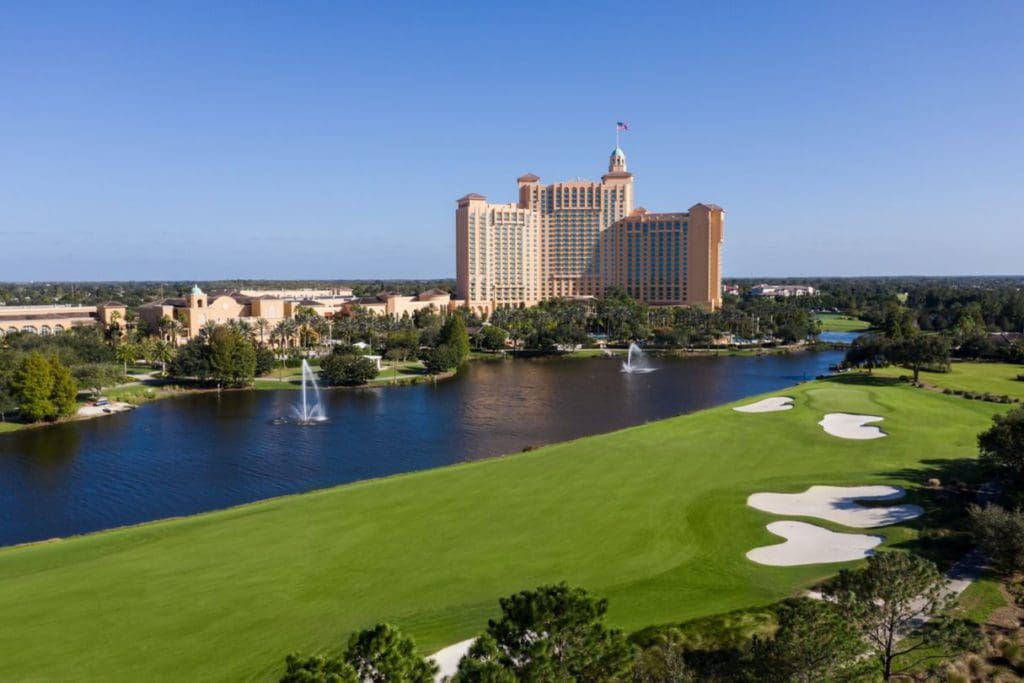 The JW Marriott Orlando, Grande Lakes stands proud across a stunning green stretch of the golf course and pond, one of the best hotels in Orlando with a waterpark for families.