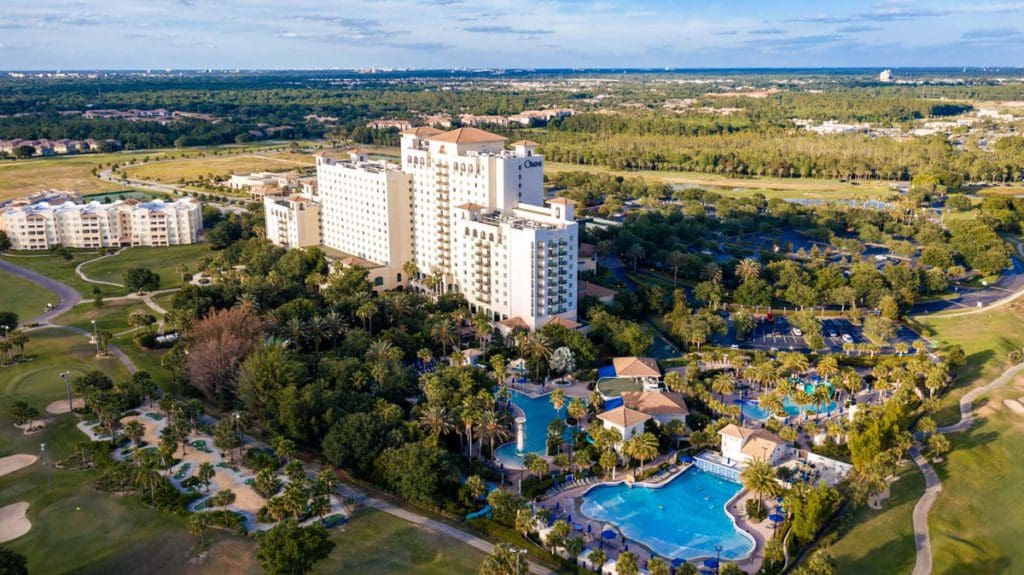 An aerial view of the grounds and resort buildings of Omni Orlando Resort at ChampionsGate, one of the best hotels in Orlando with a waterpark for families.