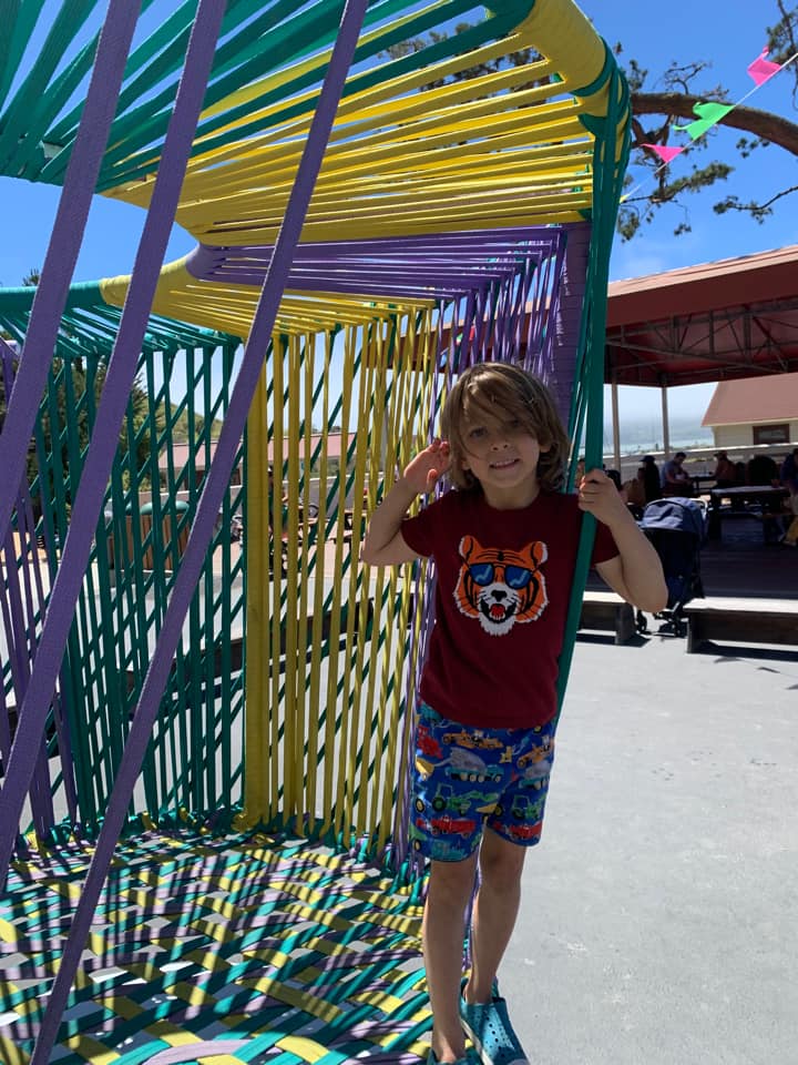 A young child plays in one of the outdoor areas at the Bay Area Discovery Museum, one of the best things to do in San Francisco with kids.