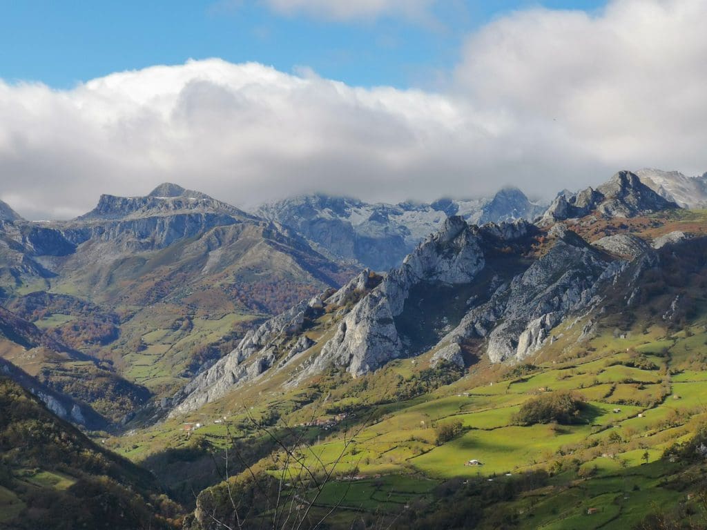 A view of the large mountain range near Asturias, one of the best mild weather European destinations for a family summer vacation.
