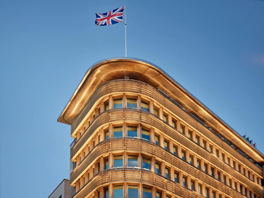 The large exterior of 45 Park Lane, with a flat atop the building.