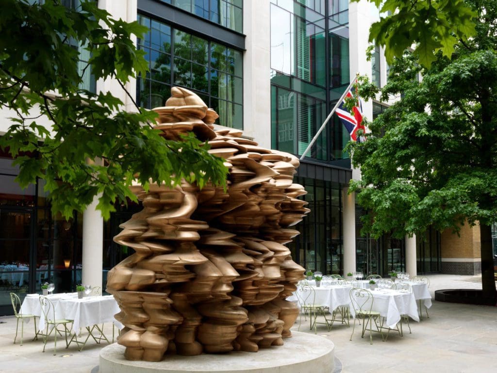 The entrance to Ham Yard Hotel, Firmdale Hotels in London, with a large art installation out front.