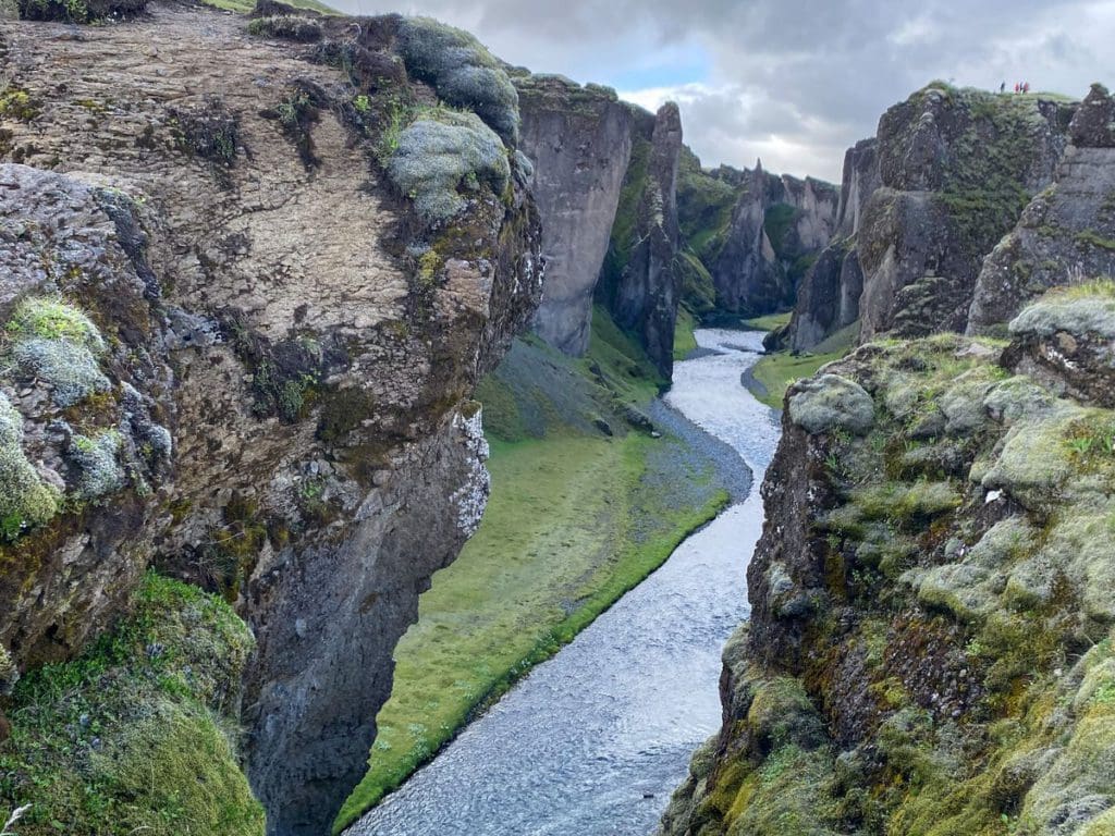 A river extends through the Fjaðrargljúfur Canyon.