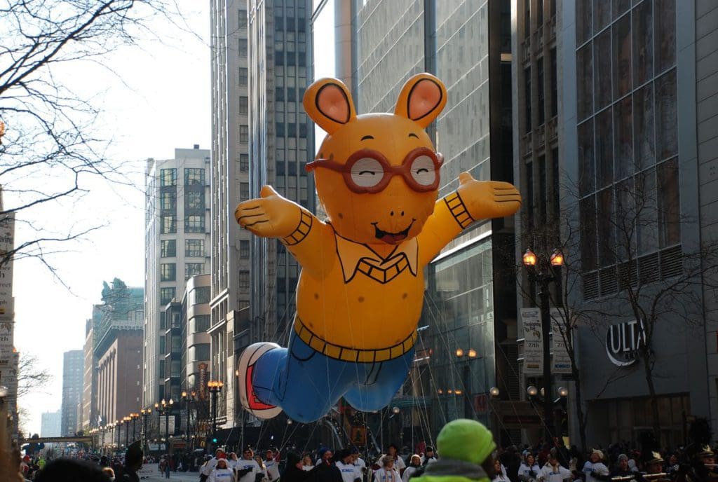 A large float of the cartoon Arthur moving down the streets of Chicago during the Thanksgiving Day Parade.