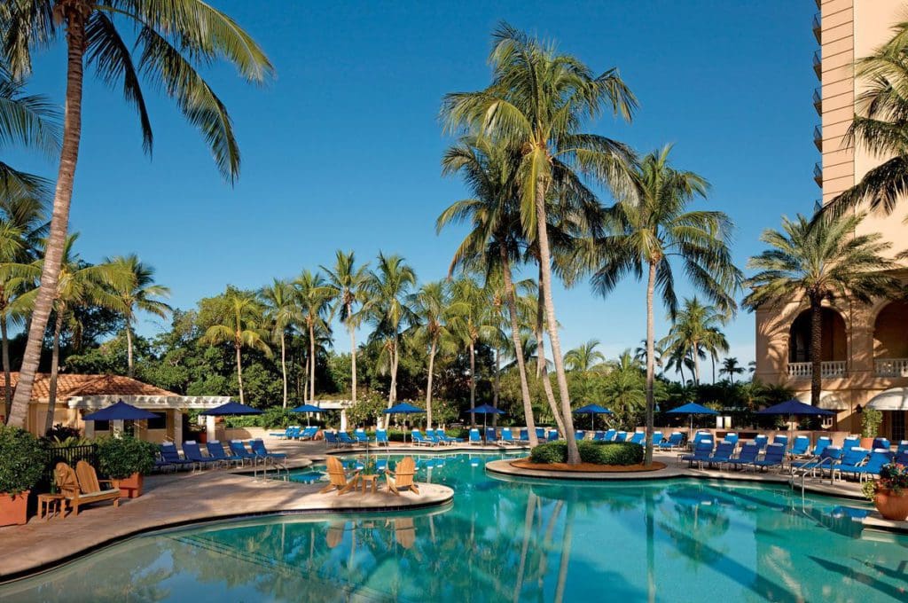 The large pool, with surrounding palm trees, at The Ritz-Carlton, Naples.