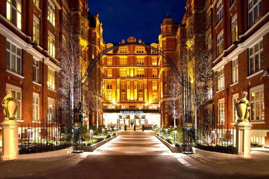 The entrance to St. Ermin’s Hotel, Autograph Collection lit up at night.