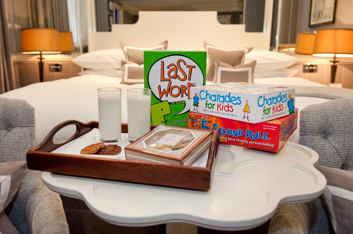 A tray of family games awaits new guests within the room at The Rubens at the Palace.