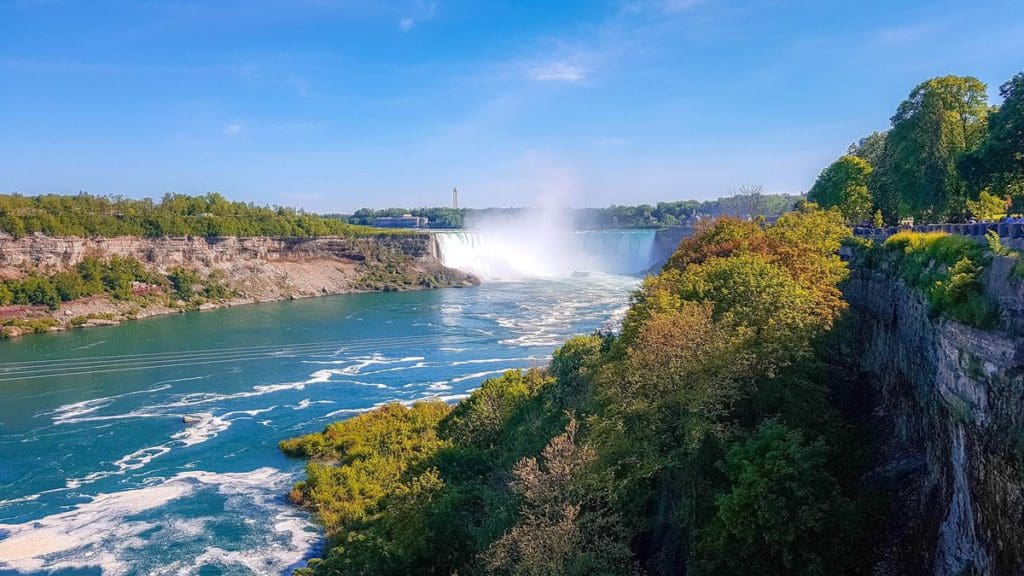 The river flowing beneath Niagara Falls on a beautiful, clear fall day in Ontario.