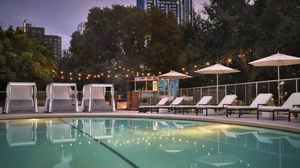 The outdoor pool at Four Seasons Hotel Austin at dusk.
