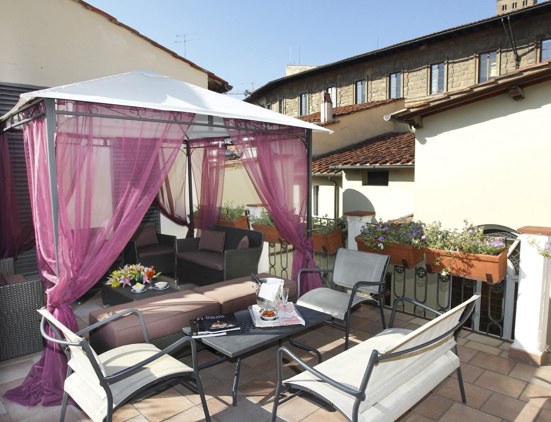 A cabana awaits guests to the rooftop of Hotel Bernini Palace on a sunny day.