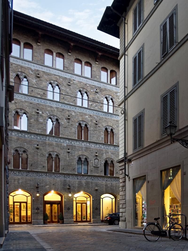 The brick exterior of Hotel Pierre at night.