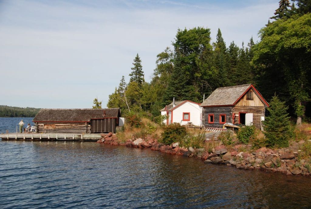 View of the Edisen fishery fish house, the primary residence (the white building) and the net house on the right in Isle Royal National Park.