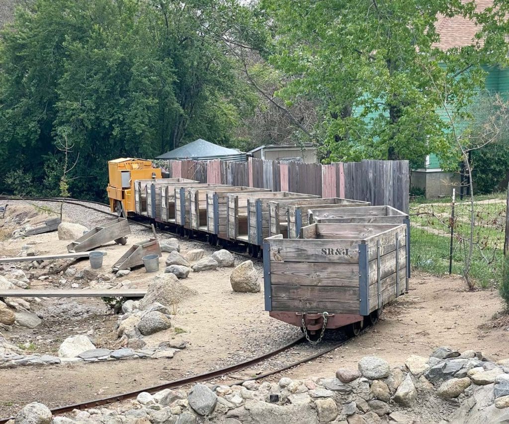 A mining cart stretches along a track at in Julian.