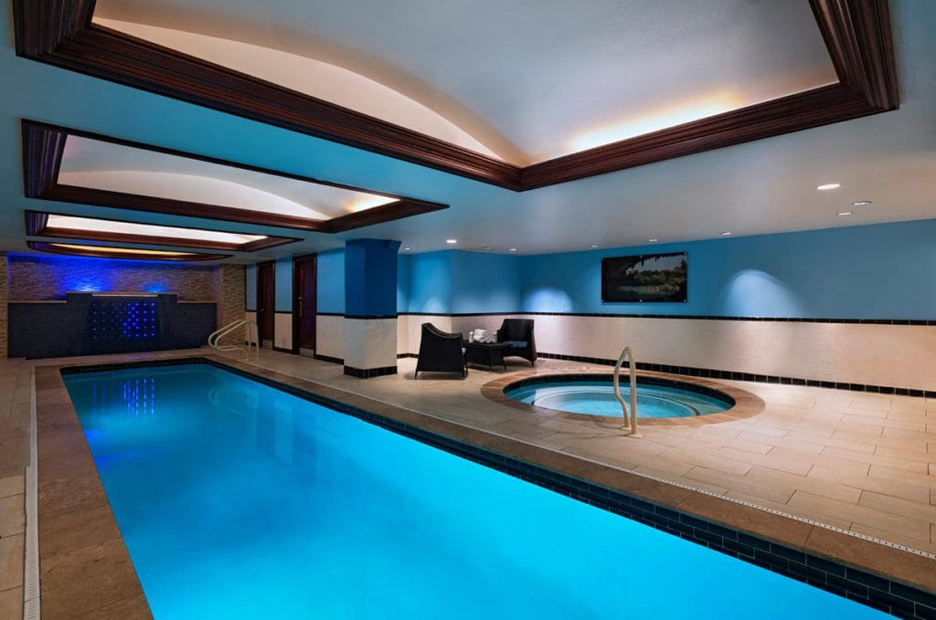 The indoor pool and whirlpool in a cozy setting at The Stephen F Austin Royal Sonesta Hotel.