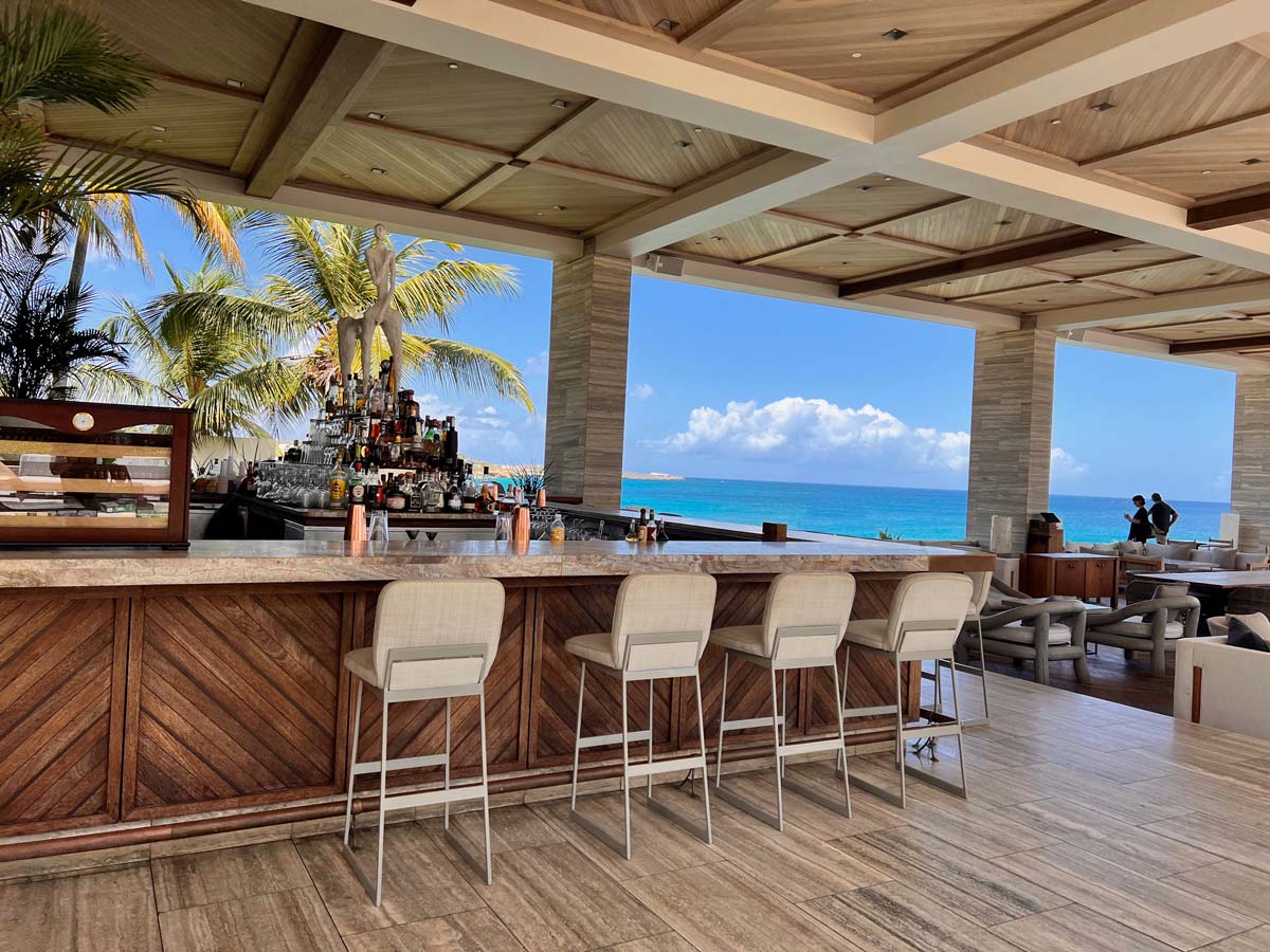 Four stool rest along the bar counter at the Sunset Lounge.