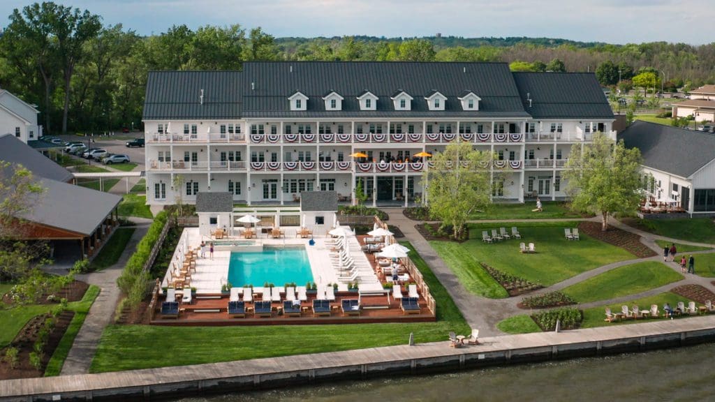 An aerial view of the resort and grounds at The Lake House On Canandaigua, featuring an outdoor pool.