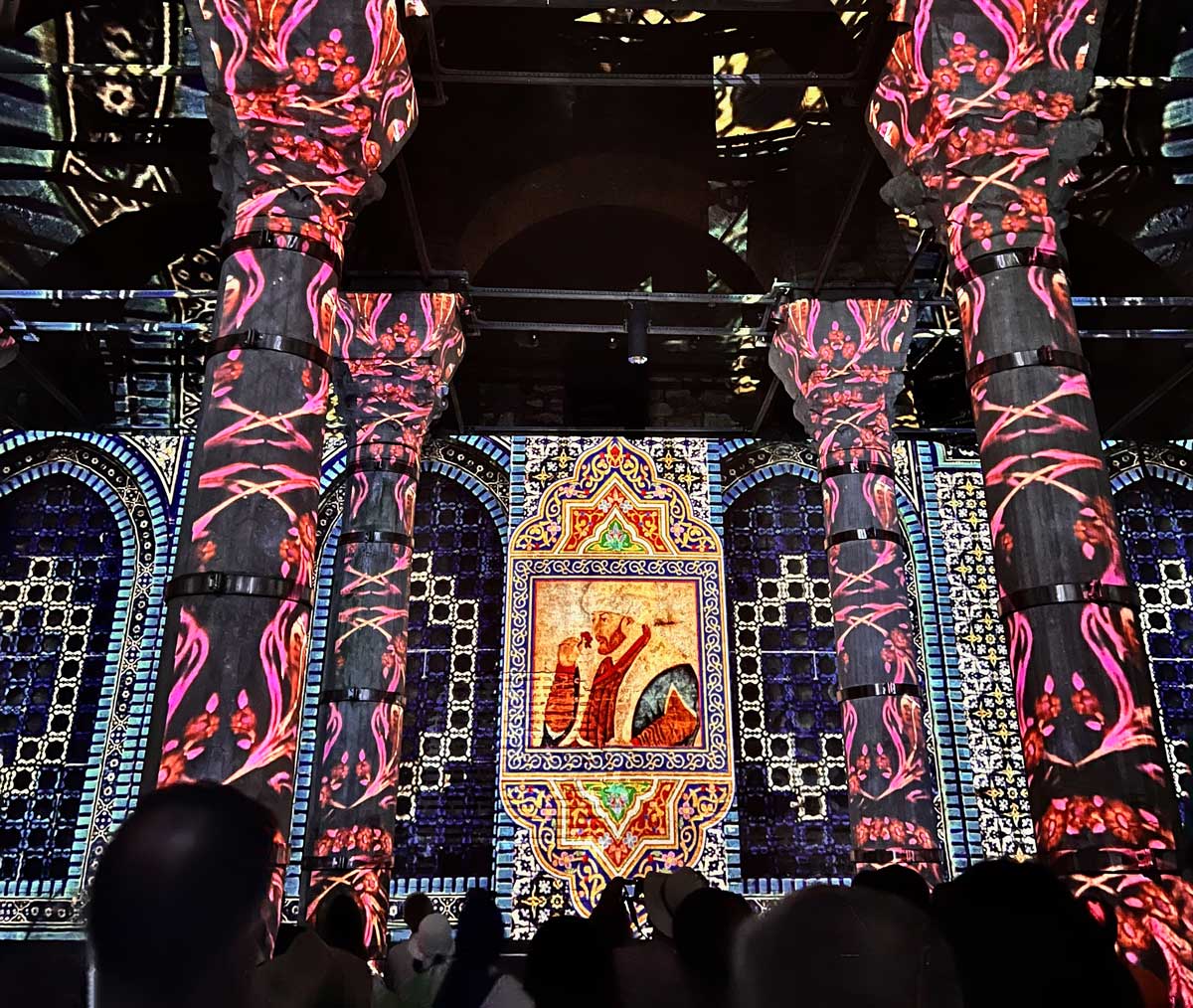 Colorful designs light up the Basilica Cisterns during the light show, one of the best things to see on a family vacation to Istanbul.