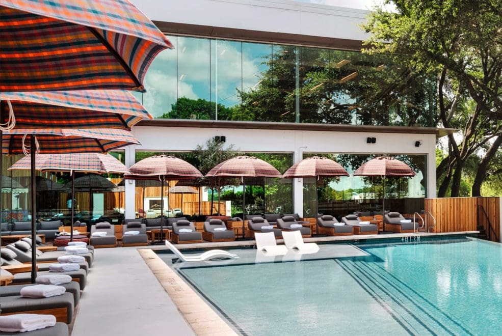 The outdoor pool, with poolside loungers flanking one side, at The Line Austin.