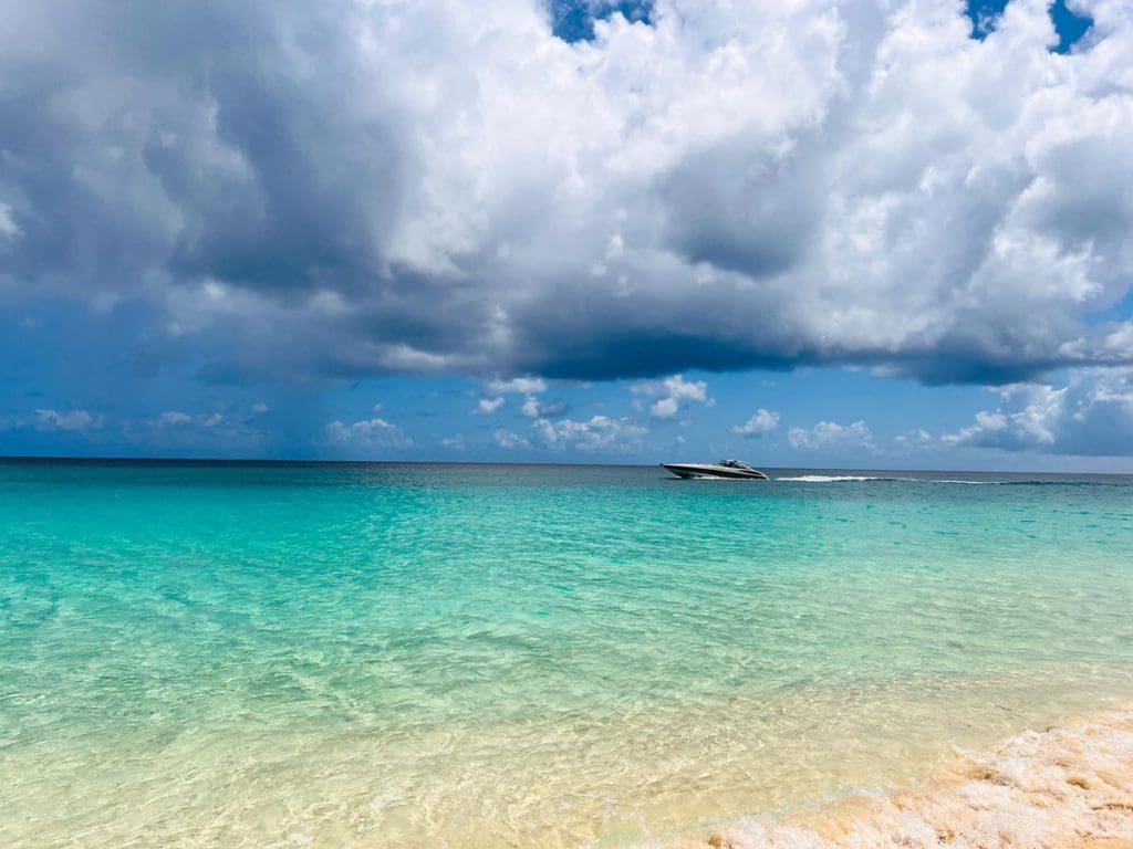 A motor boat moves through the water offshore from Anguilla.