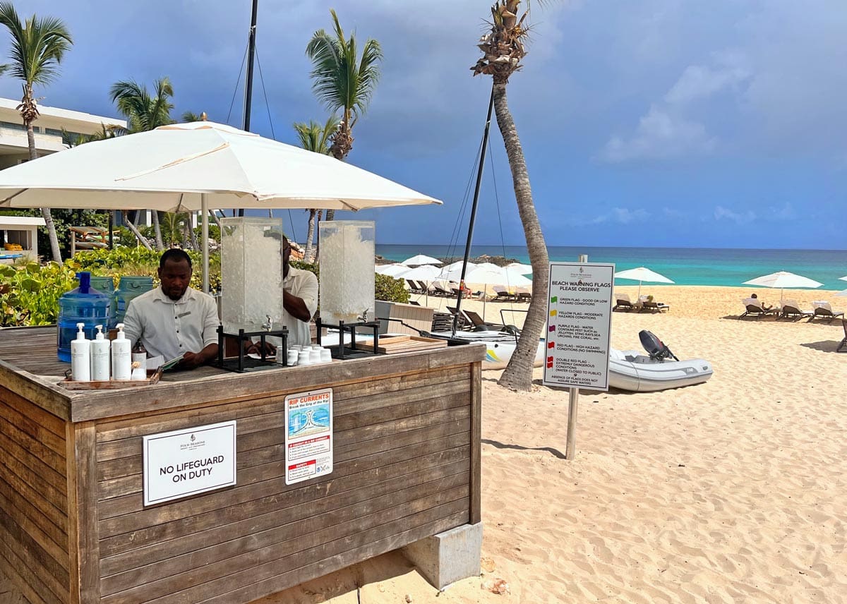 A beachside snack bar with attendant at Four Seasons Resort and Residences Anguilla.