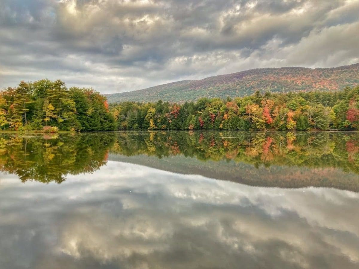 A lovely array of fall foliage across a lake in Bennington.