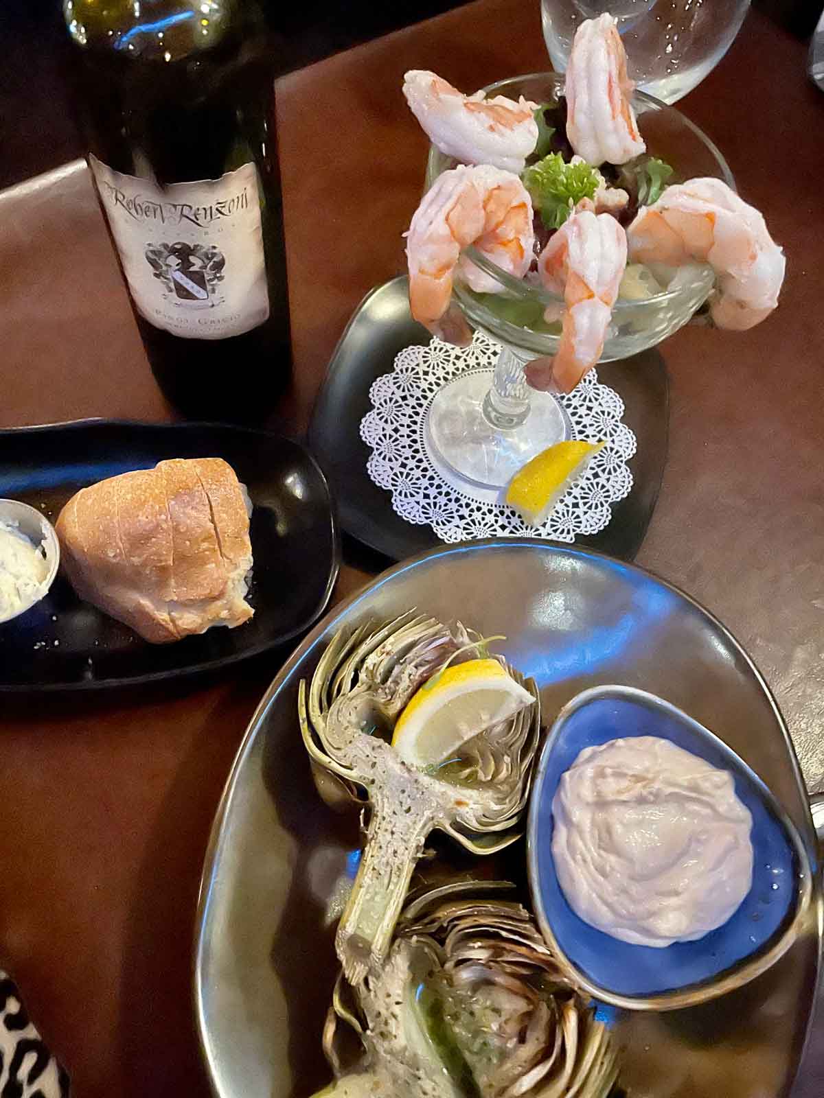 A tabled at Gambling Cowboy filled with food.