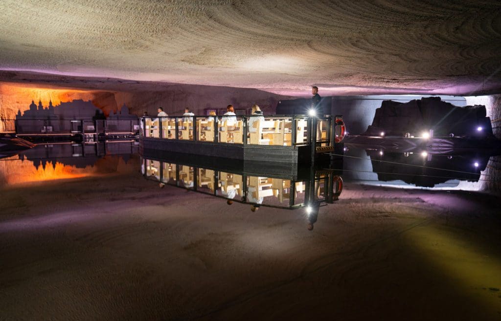 Individuals on a tour of a salt mine near Salzburg.