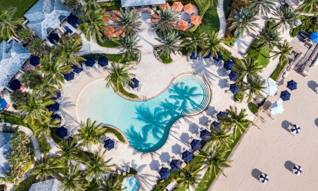 An aerial view of the outdoor pool and surrounding pool deck in the hot Florida sun at The Breakers.