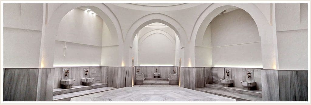 Inside a traditional Turkish Hammam, with a white interior.