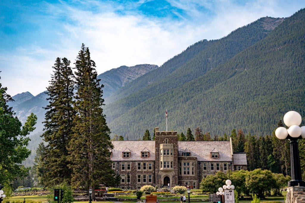 Cascade of Time Garden, featuring a large building nestled in the Canadian Rockies.