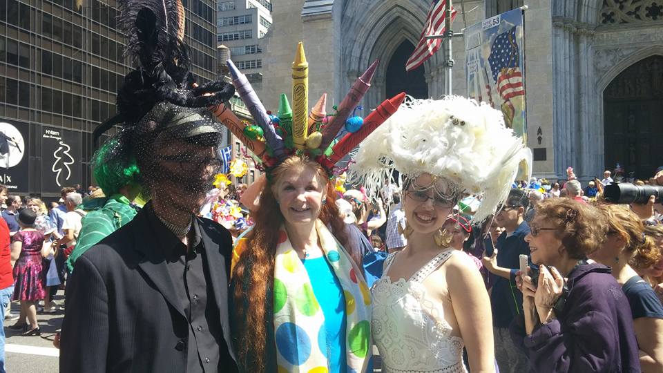 Three participants in the New York City Easter Bonnet Parade down 5th Ave in New York City, one of the best places to visit in the US during Easter Break with kids!.