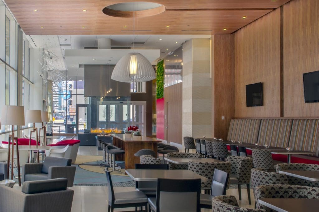 The charming lobby area of Hampton Inn & Suites Denver Downtown-Convention Center, featuring gentle colors.