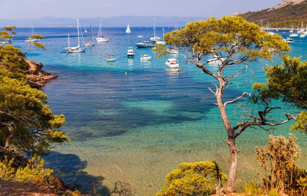 Boats float in a port off-shore from Porquerolles.