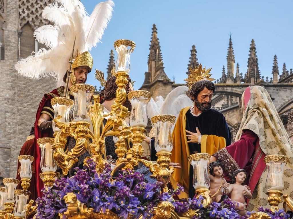 Religious icons set up outside during the Easter celebrations in Seville, one of the best places to visit during Easter with your family.