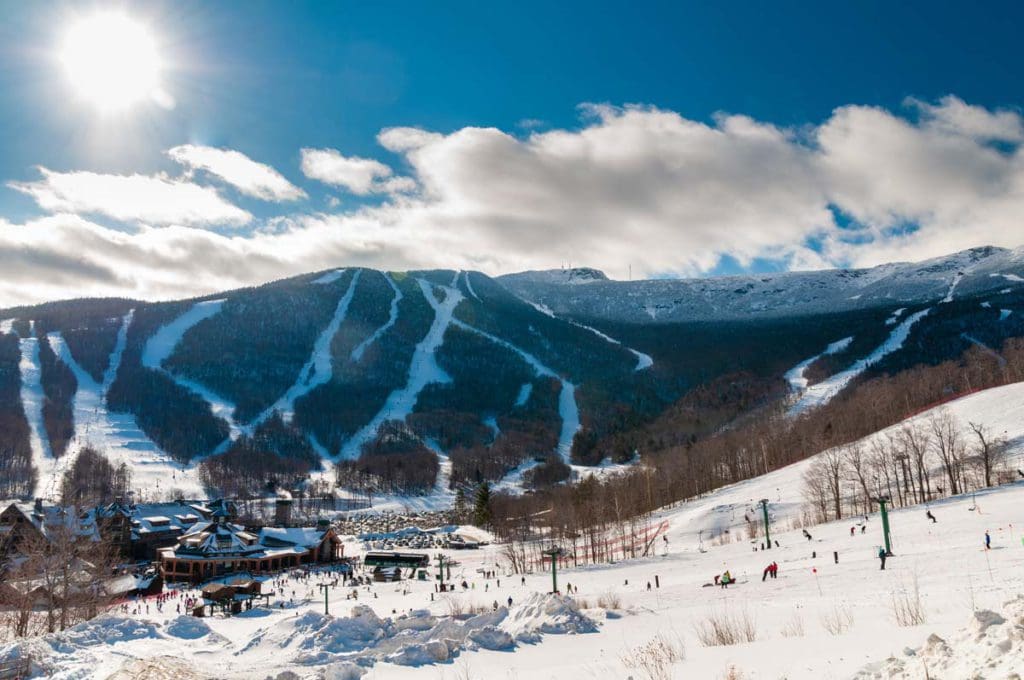 Spruce Resort nestled amongst snow and ski runs in the winter in Stowe.