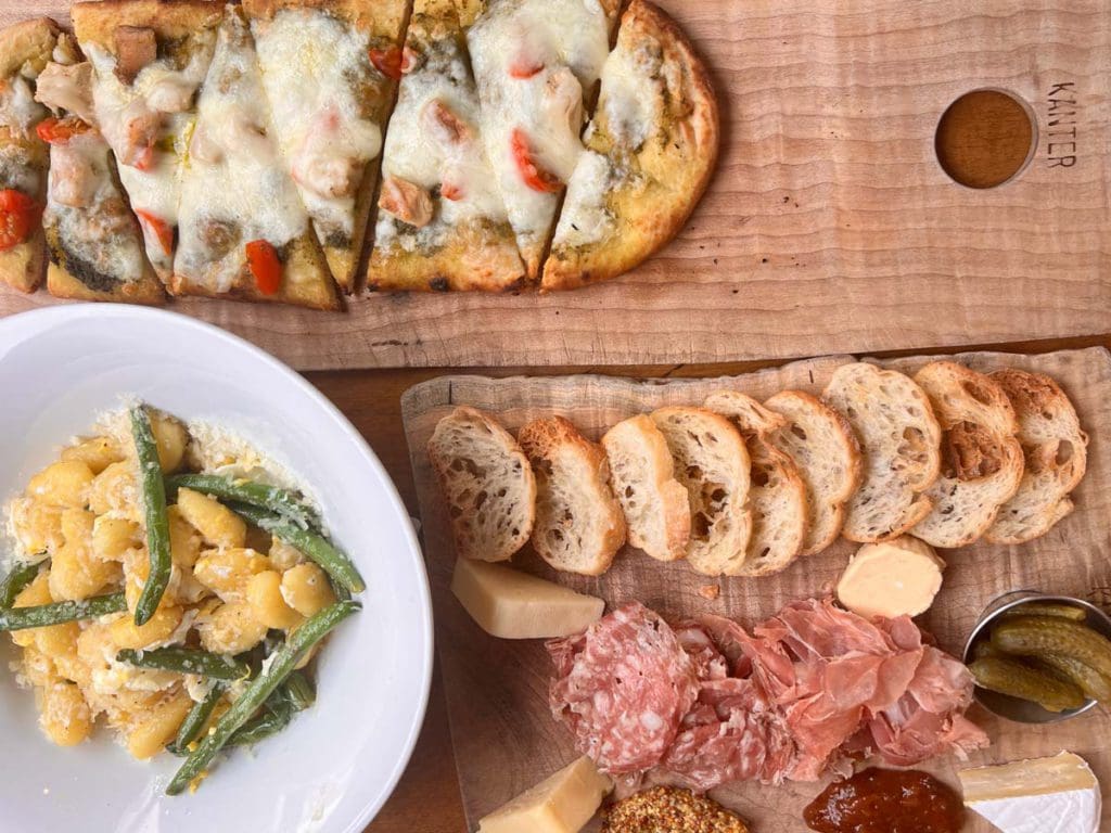 A table filled with menu items at Berkshire Palate, one of the best places to eat on this weekend getaway itinerary for families in Pittsfield.