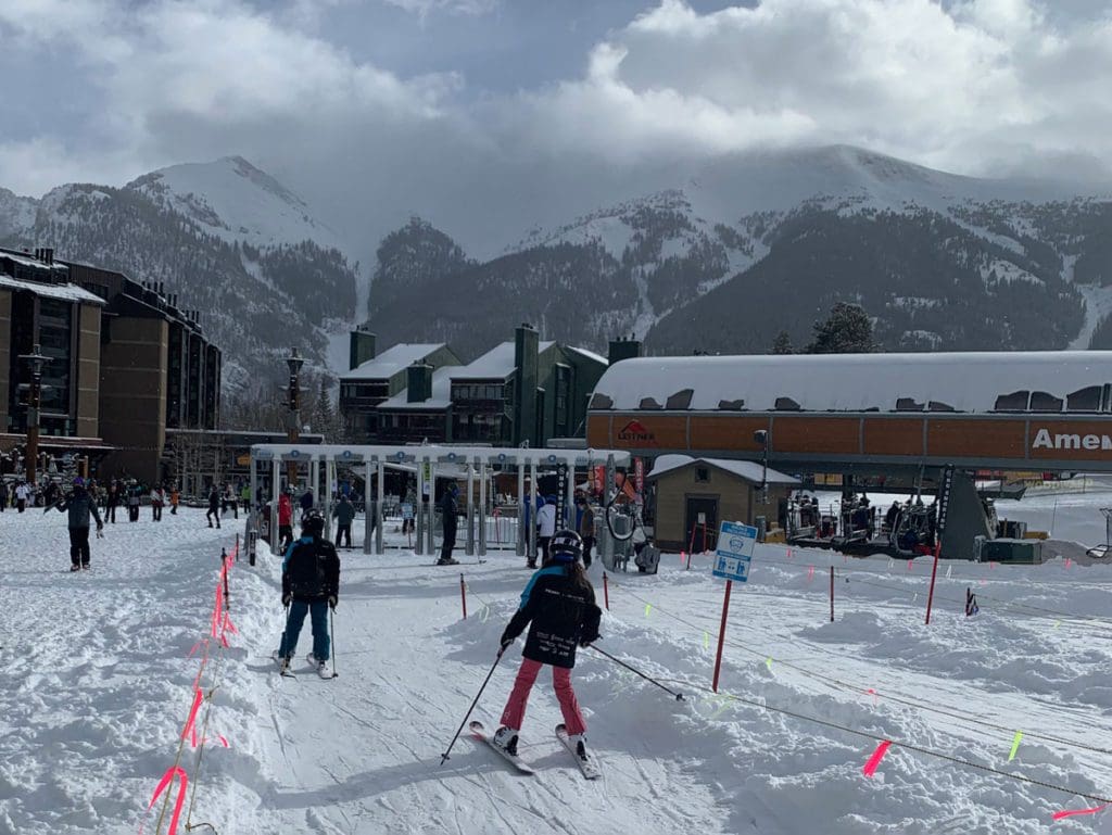 Two young skiers ski across the grounds of Copper Mountain Resort, near Frisco.