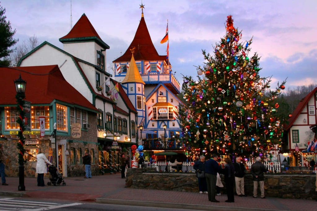 People explore the Christmas market in Helen, Georgia, one of the best American cities that feel like Europe for families.