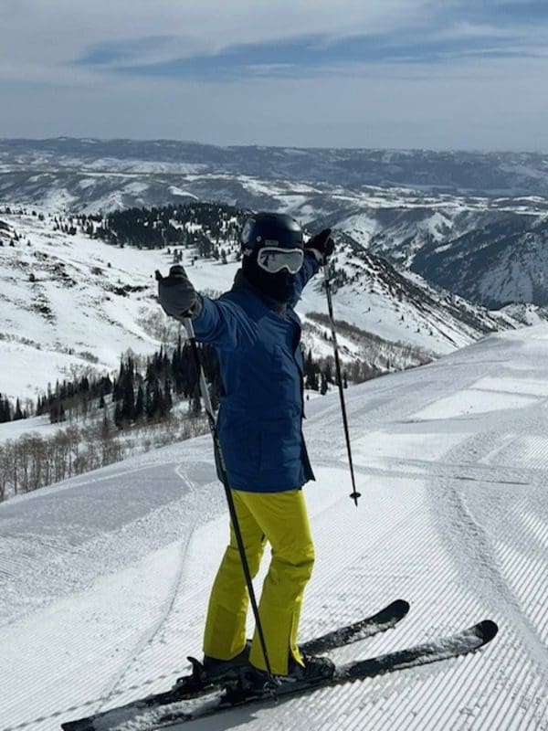 A young boy skis down a slope in Stowe, while skiing with his family.