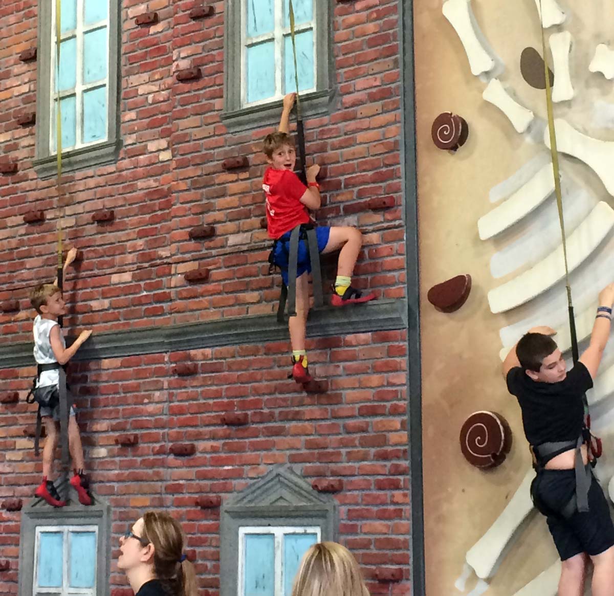 A child climbs along a wall at Chattanooga High Point Climbing.