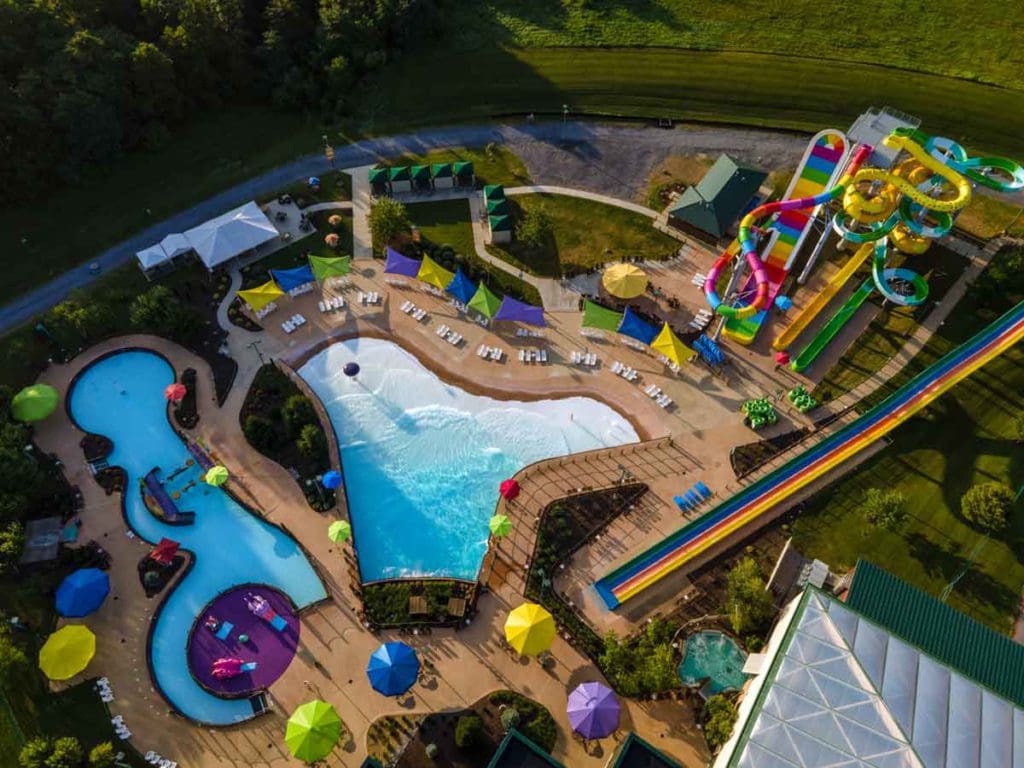 An aerial view of the vast and colorful outdoor water park at Massanutten Resort.
