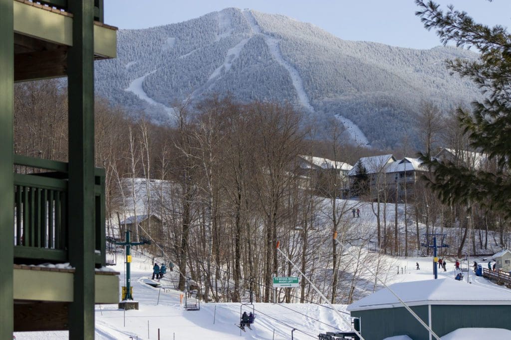 A view of Smugglers' Notch Resort from Mountainside Lodging, with property balconies in the foreground.