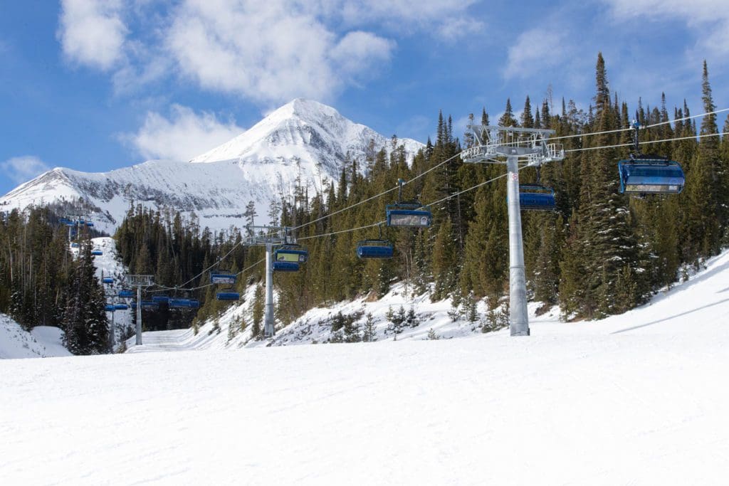 Gondolas carry people up the mountain in Big Sky, Montana.