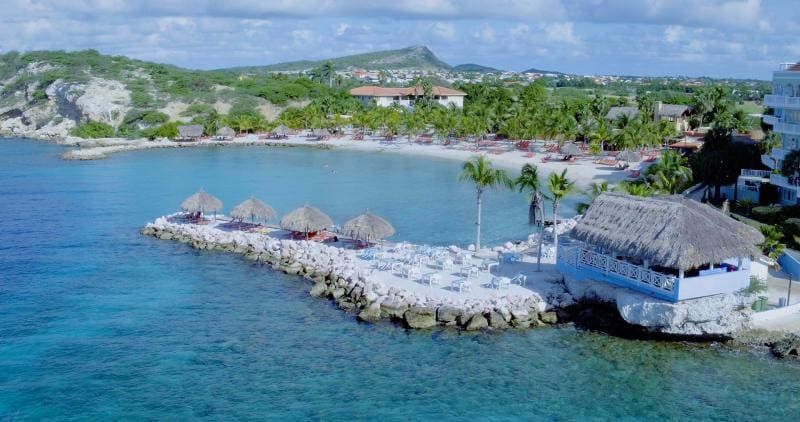 An aerial view of Blue Bay Curaçao, nestled along a stunning beach, one of the best Curacao resort with kids.