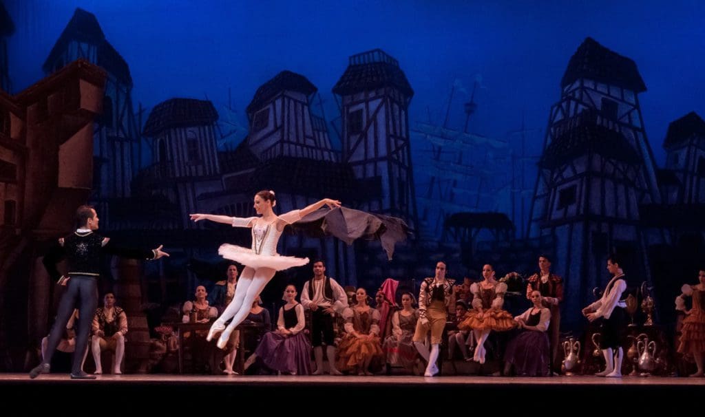 Ballet dancers preform on stage.