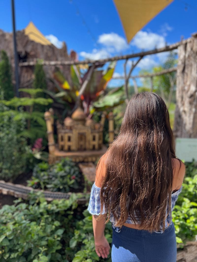 A young girl explore the Biltmore Village on a sunny day, a fun activity on any Asheville family vacation itinerary.